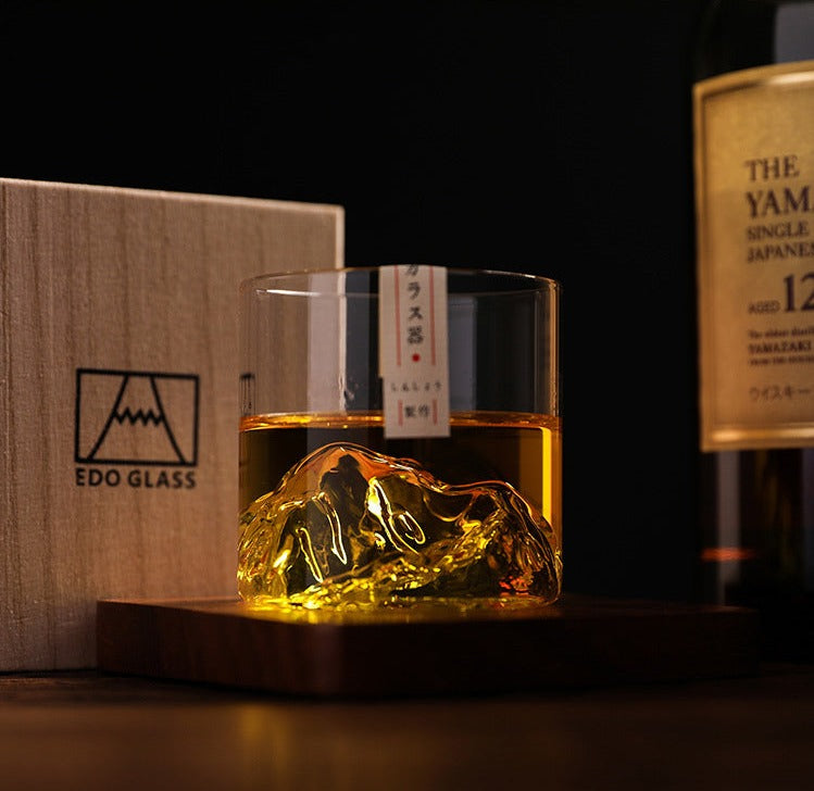Premium whiskey glass with 3D mountain terrain at the base