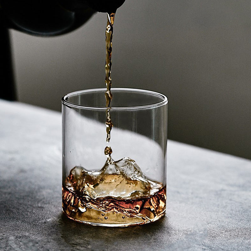 Whiskey glass with mountainous terrain, perfect for nature enthusiasts