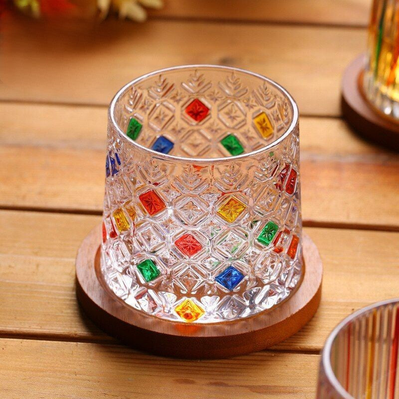 Unique rocking whiskey glass with vibrant hues.