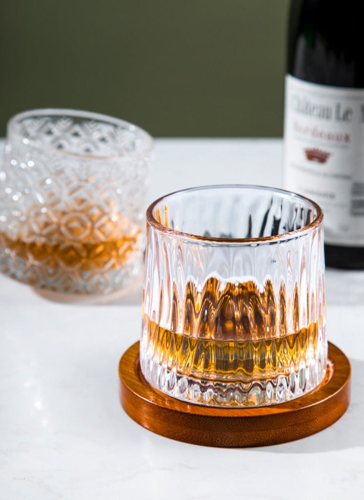a rocking whiskey glasses on a coaster at a fine dining table